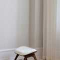 UMAGE_lifestyle_The Reader_ottoman_dark oak_teddy white_(3).jpeg